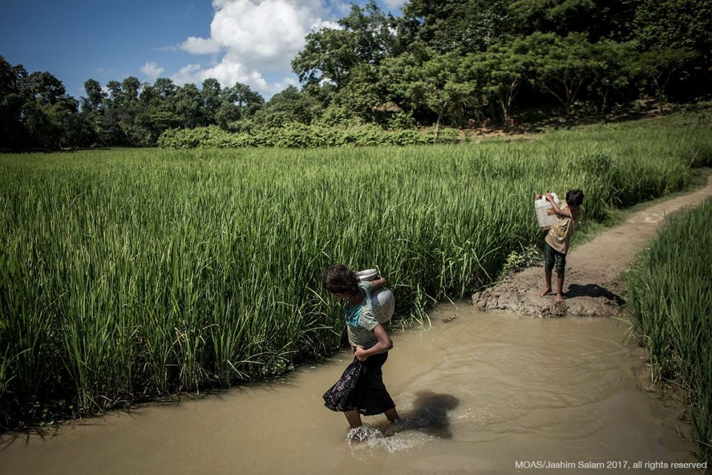 Children carrying water