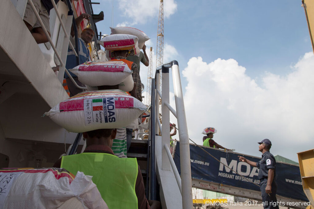 Food is taken from the Phoenix after MOAS had delivered 20 tonnes of food aid to the Bangladeshi authorities.